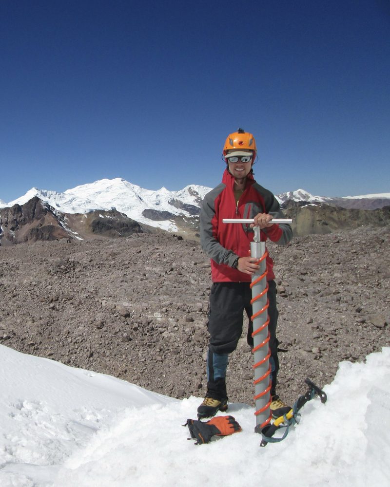 Skylar collecting an ice core sample in the Peruvian Andes